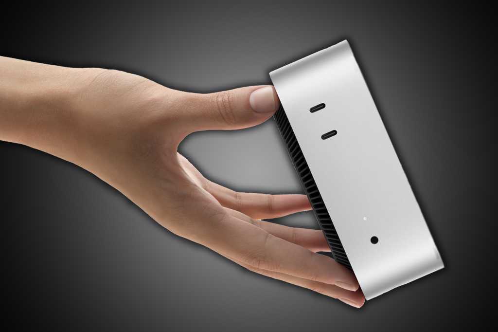 Hand tossing a Mac mini off the screen